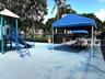 Canopy shaded picnic table at the tot lot