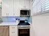 Notice all the cabinet space that you have and the kitchen even has a window for addded natural light.