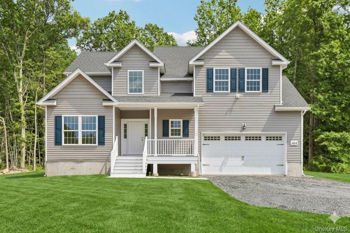 Beautiful colonial home. Lawn is an AI-generated rendering.