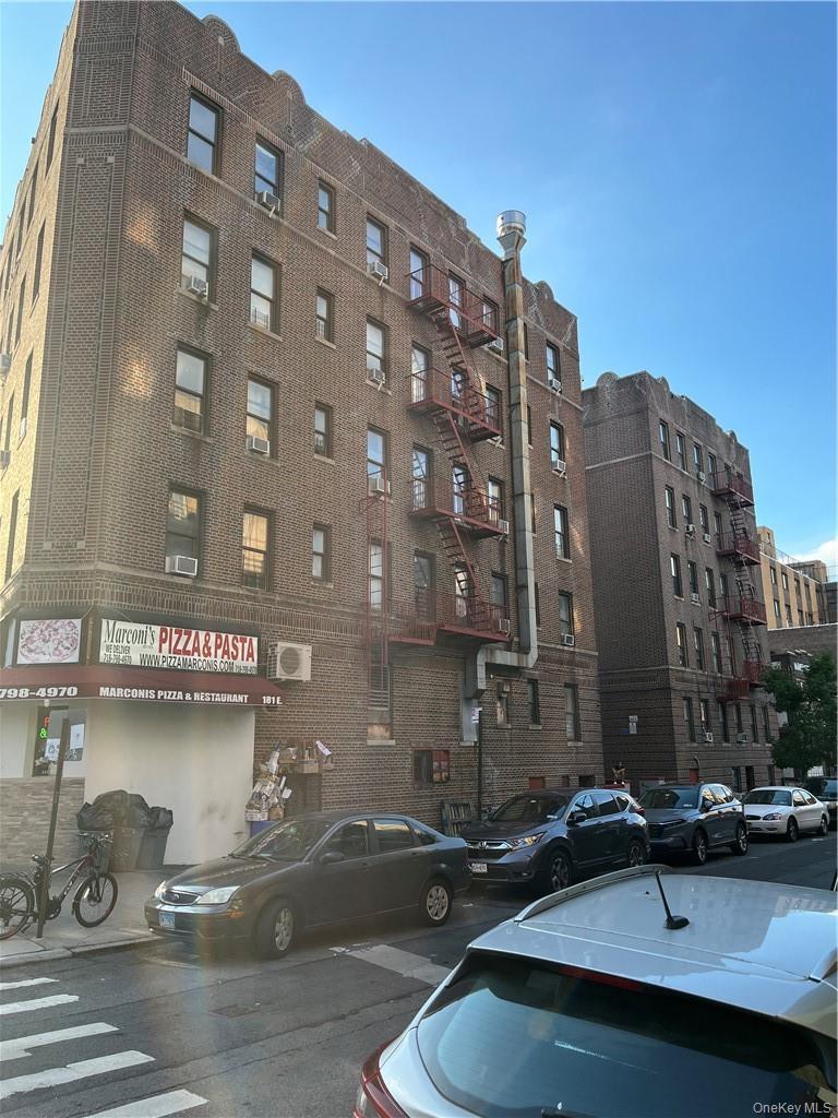 View of building exterior with a wall mounted AC