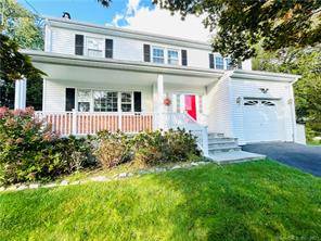 Updated and spacious 4 Bedrooms Colonial featuring central air, hardwood floors, fireplace and lots of natural light.