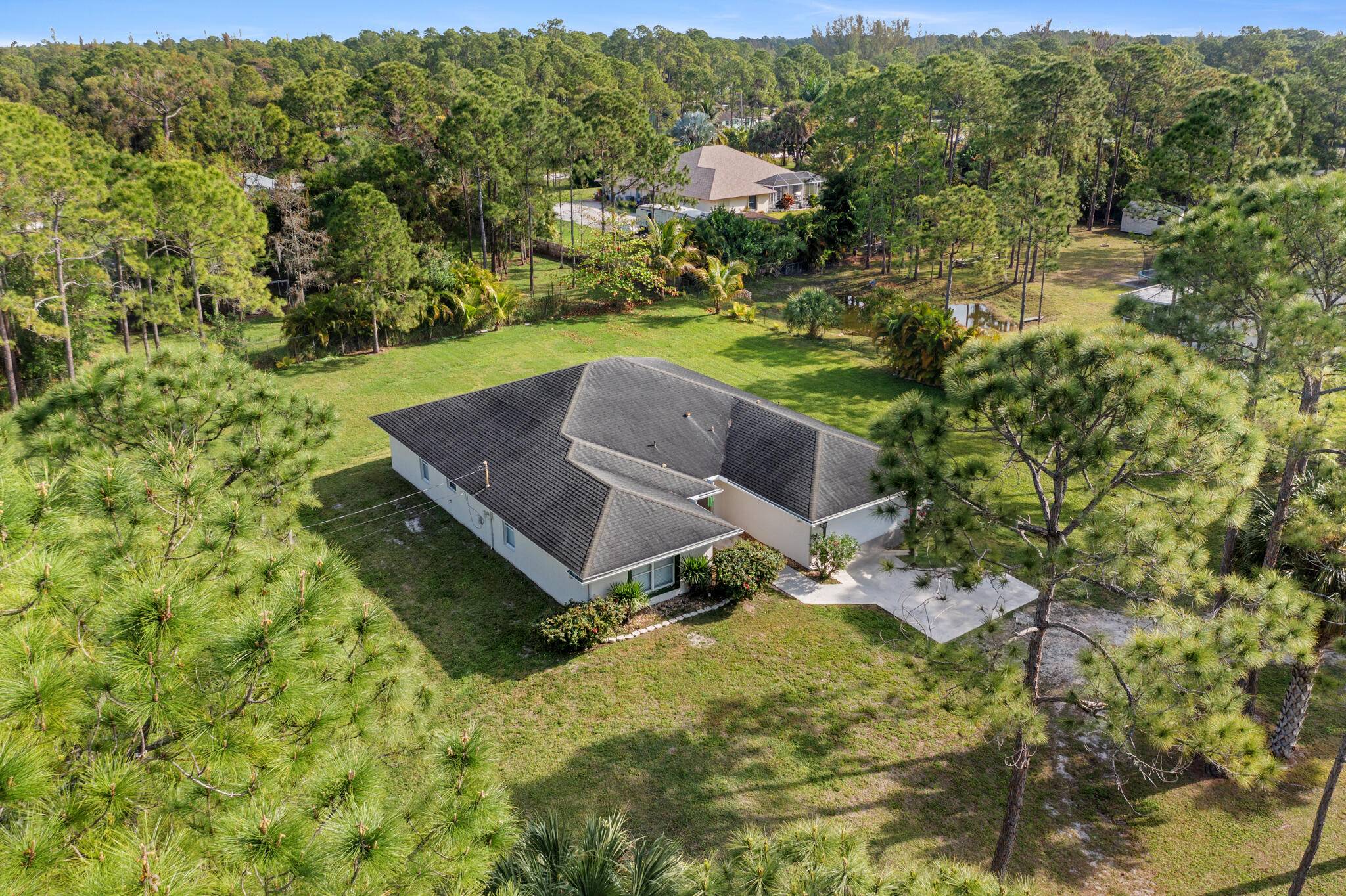 Nestled in the peaceful Loxahatchee, Florida, this exquisite detached home offers the perfect blend of luxury, comfort, and tranquility sitting on a 1.