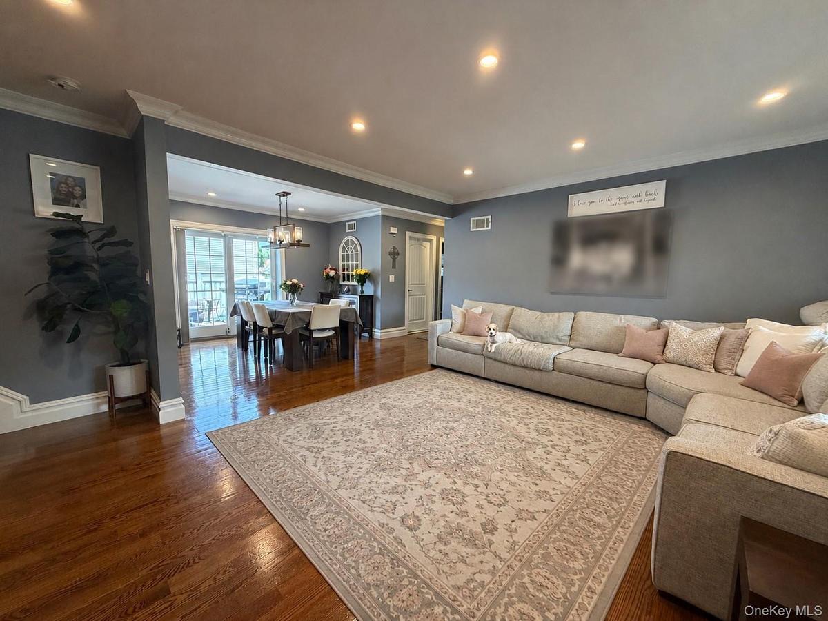 Spacious living room open to dining room and kitchen.