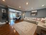 Spacious living room open to dining room and kitchen.