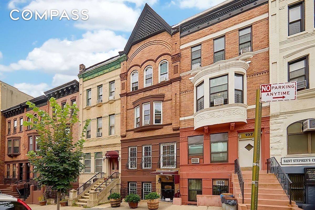 The renovated townhouse offers vintage hickory flooring throughout, 12' high Ceilings, crown molding, exposed brick, noise cancellation windows, front facing bay windows on parlor level, original tier on tier wood ...
