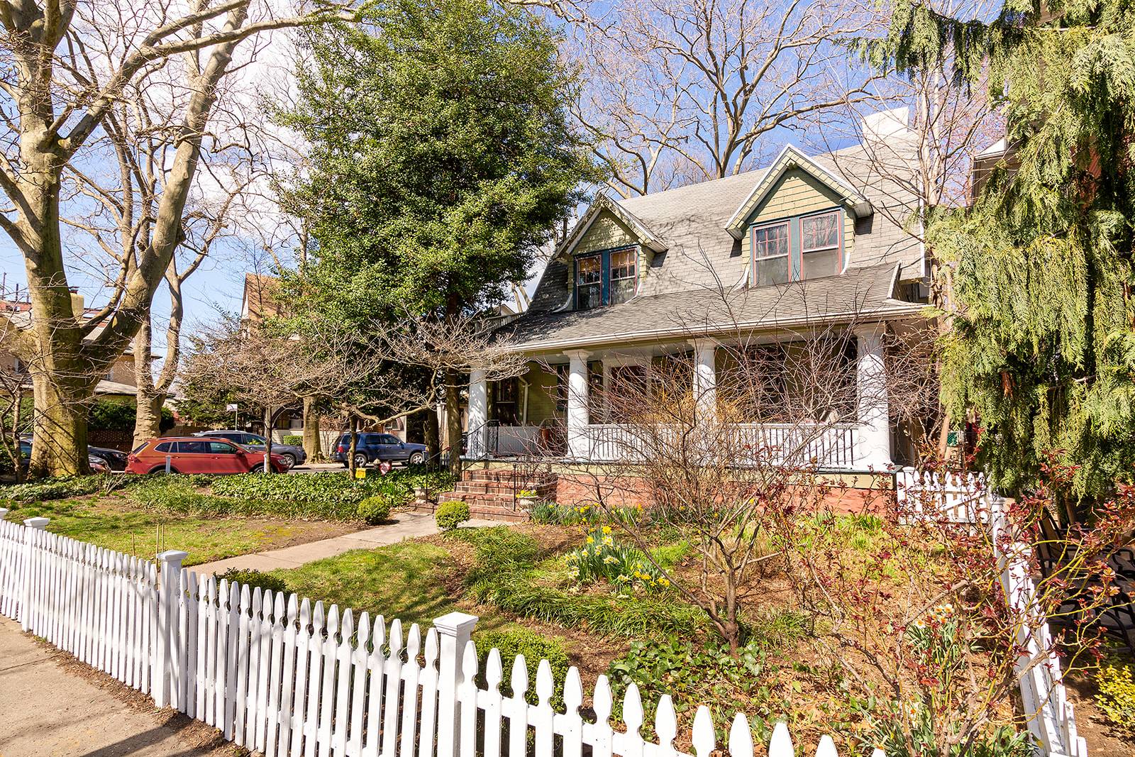 1101 Ditmas Avenue is an enchanting 1899 built Colonial situated on a picturesque corner lot with generous bucolic front and side gardens, with old growth Sycamores, surrounded by a white ...
