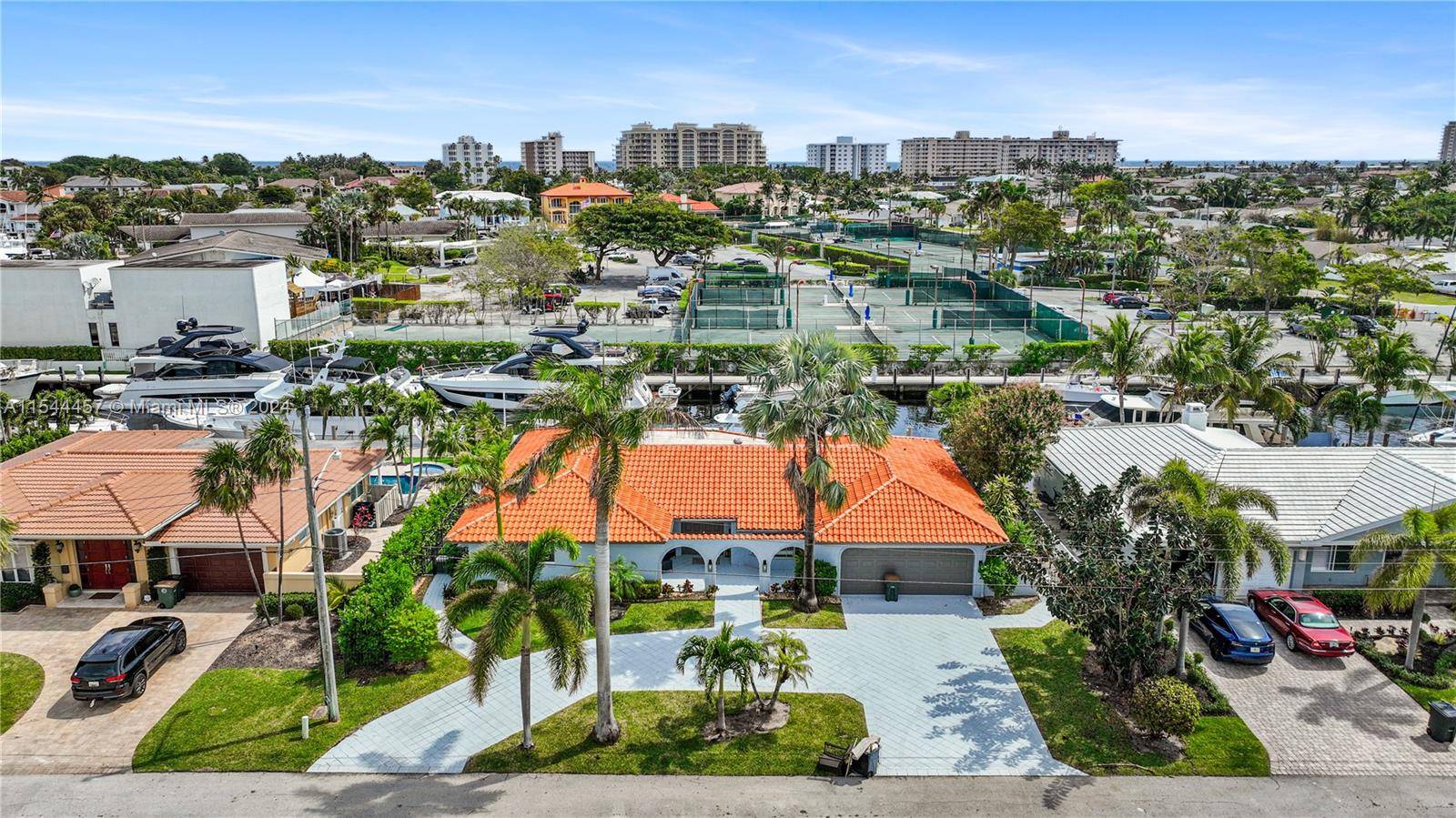 Welcome to this charming three bedroom, three bathroom home located in the prestigious Venetian Isles of Lighthouse Point, just minutes from the yacht club and the Hillsboro Inlet.