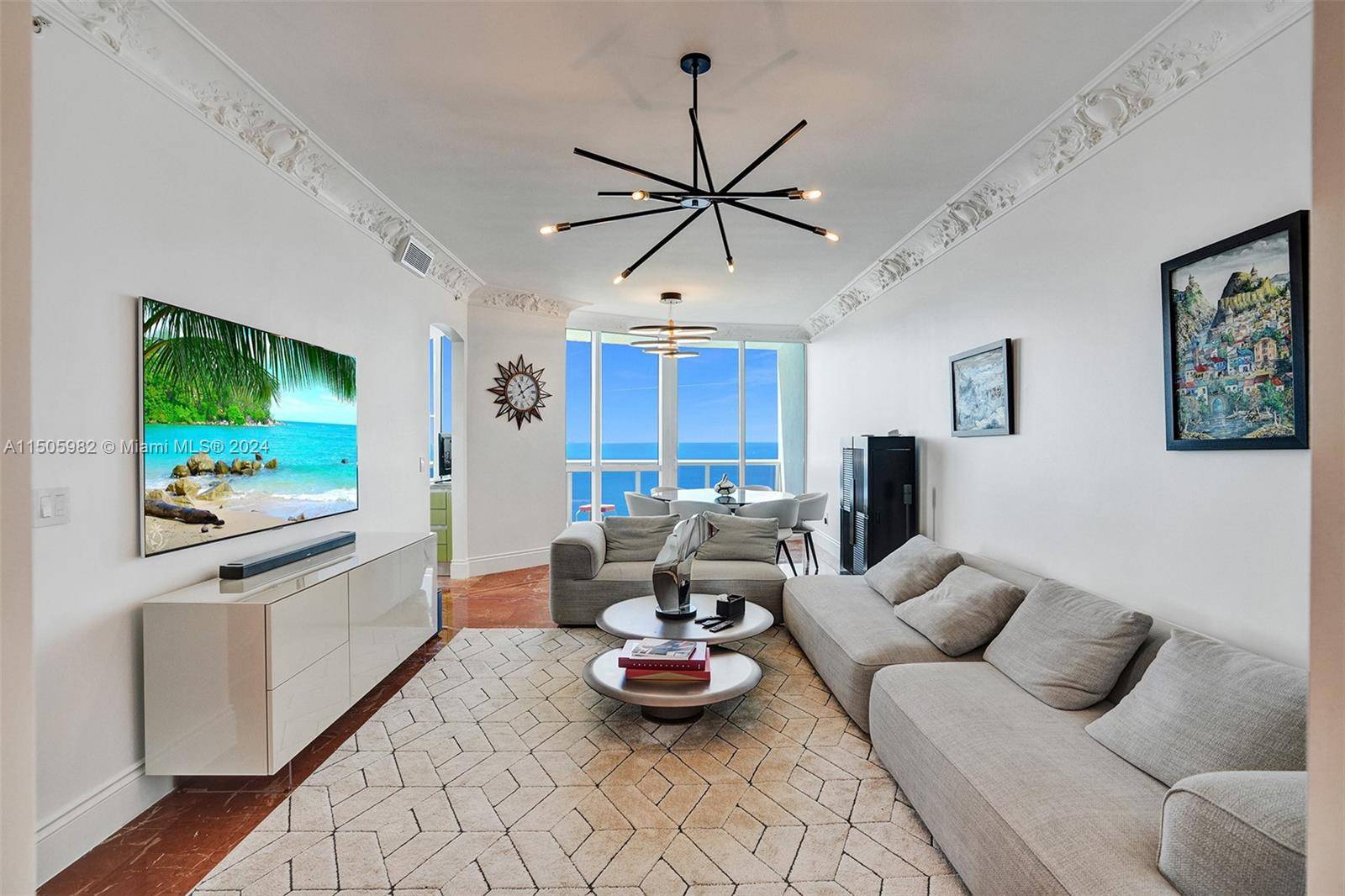 Immaculate oceanfront residence with luxurious upgrades at Trump Royale.