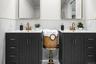 Custom cabinetry and coordinated finishes combine style and functionality in this beautifully renovated ensuite.