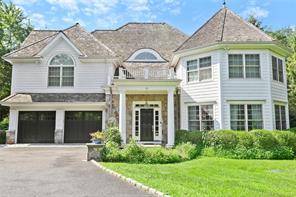 This striking shingle style open floor plan home has it all and is just seconds to town !