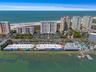 Aerial view of Shopping Center with restaurants (Columbia, Backwaters etc) with waterfront dining that is just across the street from the community!