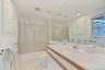 Full bedroom with bathtub, shower & recessed lighting, vanity, visible vents, and combined bath/shower with glass door