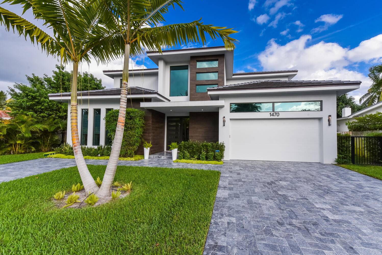 Stunning contemporary home located in the coveted Golden Triangle area, positioned conveniently between Mizner Park and the 20th Street shopping district, the open floor plan immediately captivates attention.