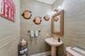 Half bath with toilet and crown molding
