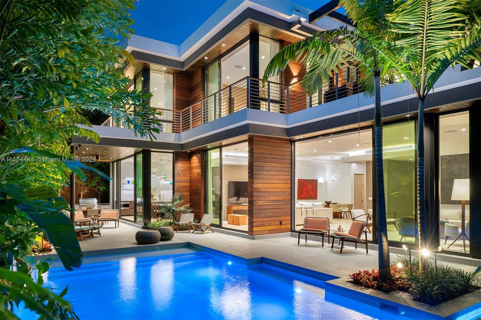 Stunning, new construction tropical modern home on a serene street in coveted North Coconut Grove, offers 7, 146 SF adj of luxury living.