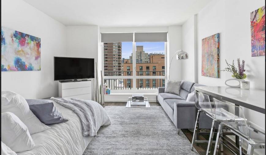 Feels like brand new ! ! Stunning studio designed by famous designer and architect, Philippe Starck features floor to ceiling windows with EMPIRE STATE VIEWS !