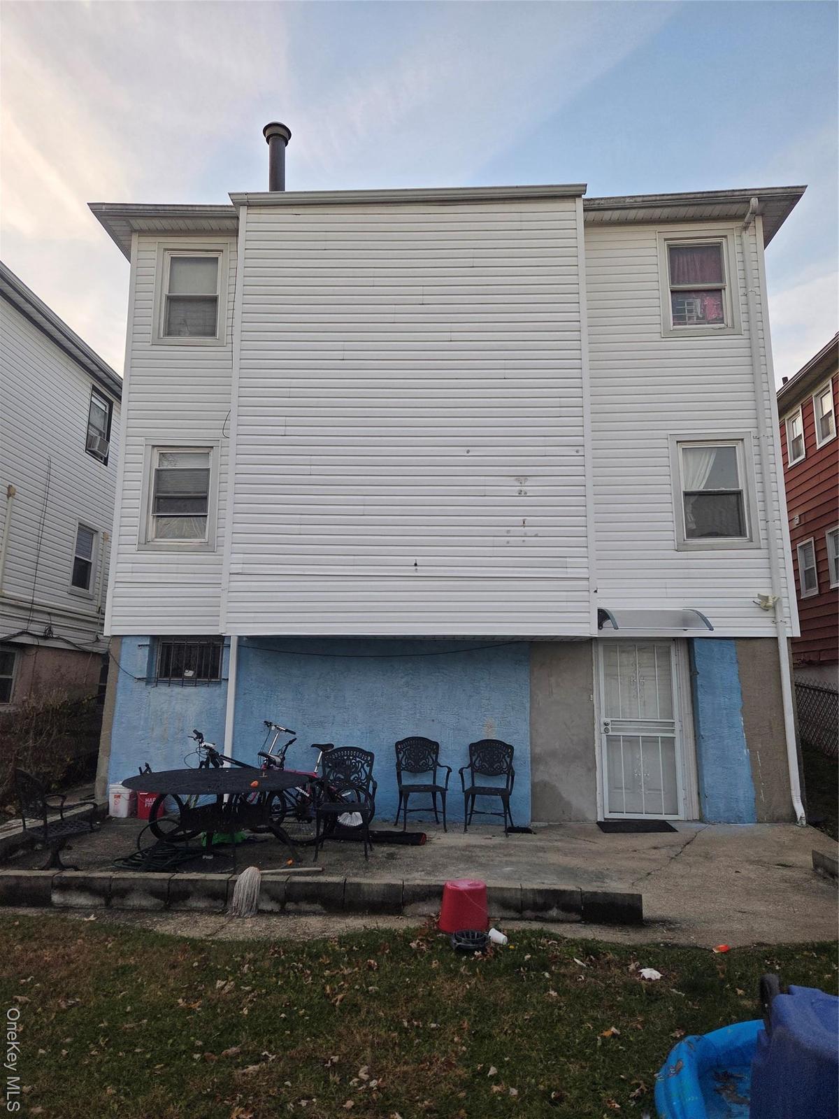Back of house with a patio
