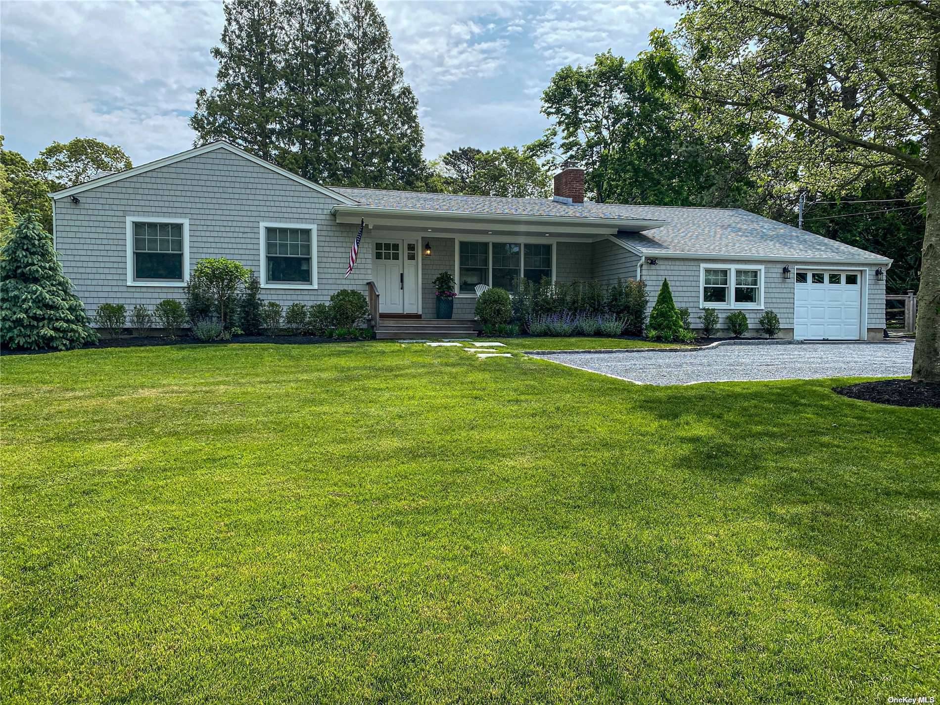 Renovated, immaculate ranch in the Village of Westhampton Beach with open living room, dining area and kitchen.
