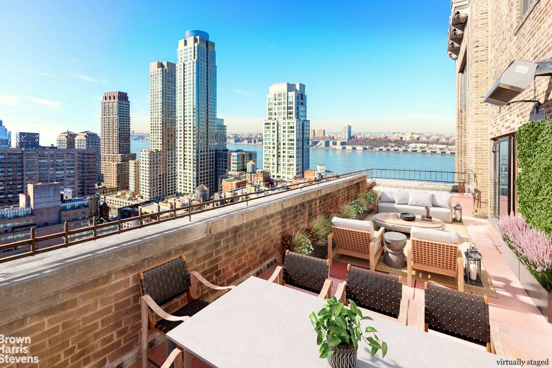 PENTHOUSE STUNNER WITH TWO MASSIVE SETBACK TERRACES AND SPECTACULAR RIVER VIEWS !