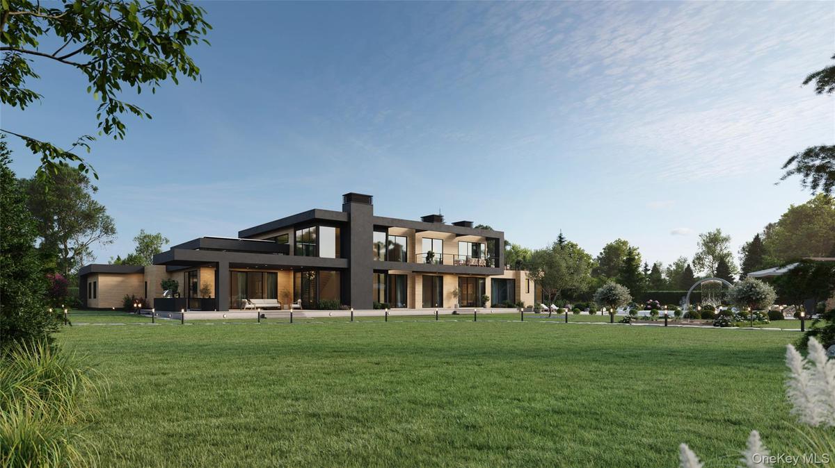 An expansive rear lawn unfolds to a sunken fire pit lounge and curated landscaping, creating a private resort-like setting. A glimpse of the outdoor k