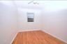 3rd Floor bedroom featuring light wood finished floors and ceiling fan