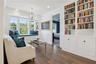 Upstairs loft with custom cabinets and bookcase