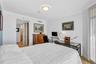 Residence Secondary / Guest Bedroom with access to the Westerly Balcony. Large Closet, with Large Walk in Shower, Storage and Bathroom. Travertine Fl