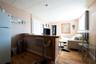 Living room with light hardwood / wood-style flooring and a paneled ceiling