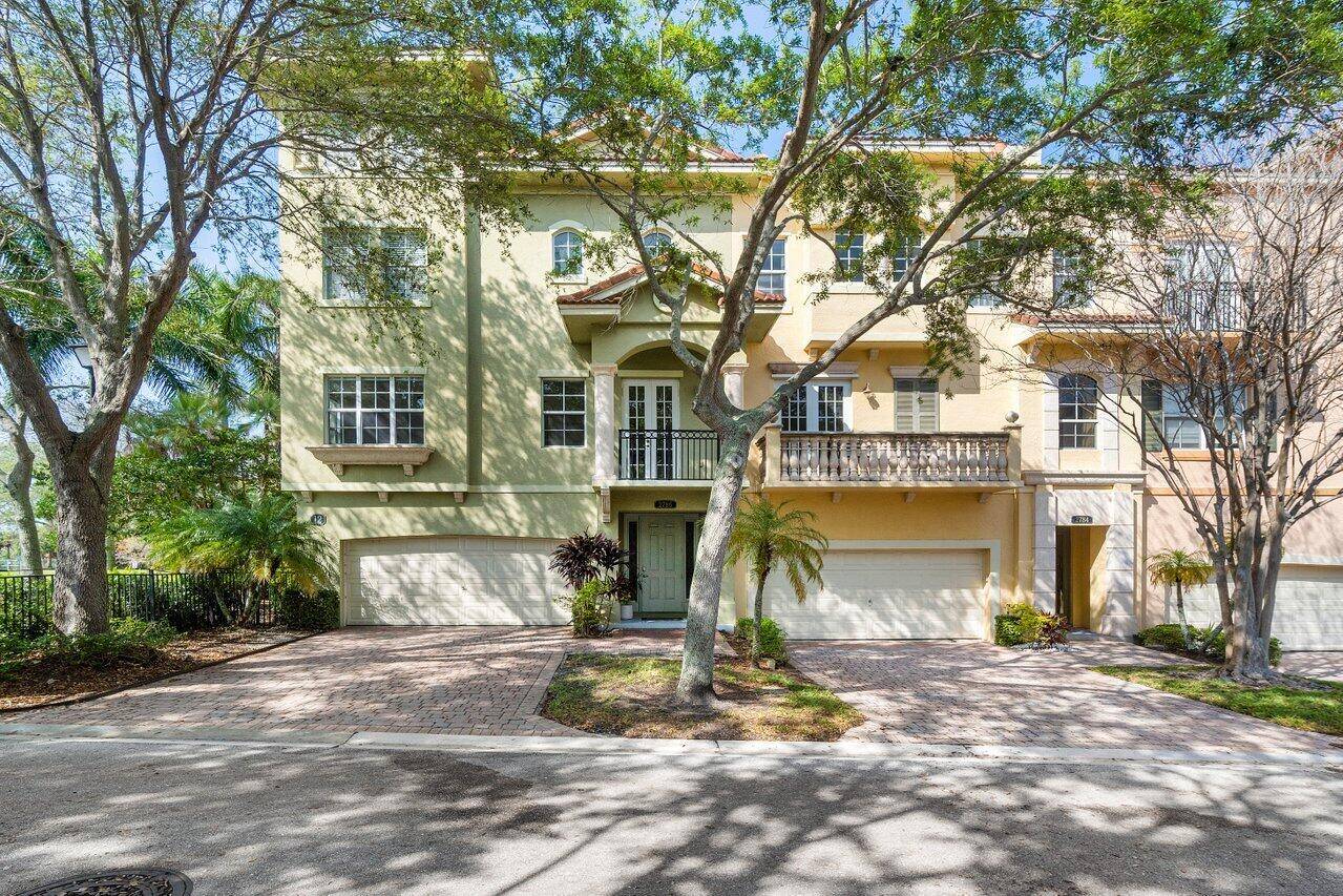 Centrally located Spacious, 4 4 bright 3 story corner Townhome in Palm Beach Gardens.
