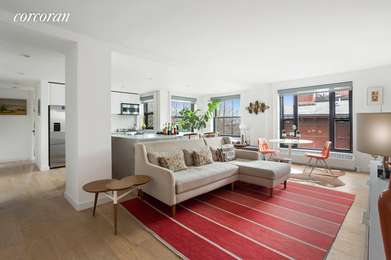 This impeccably renovated, loft like home delivers bright light and views of brownstone Brooklyn from six oversized windows and two exposures.