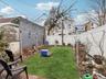 View of fenced backyard
