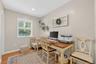 Home office featuring wooden walls, recessed lighting, and light wood-style flooring
