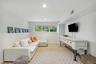 Living room featuring light carpet