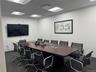Office space with a paneled ceiling