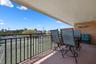 Covered lanai overlooking tennis courts
