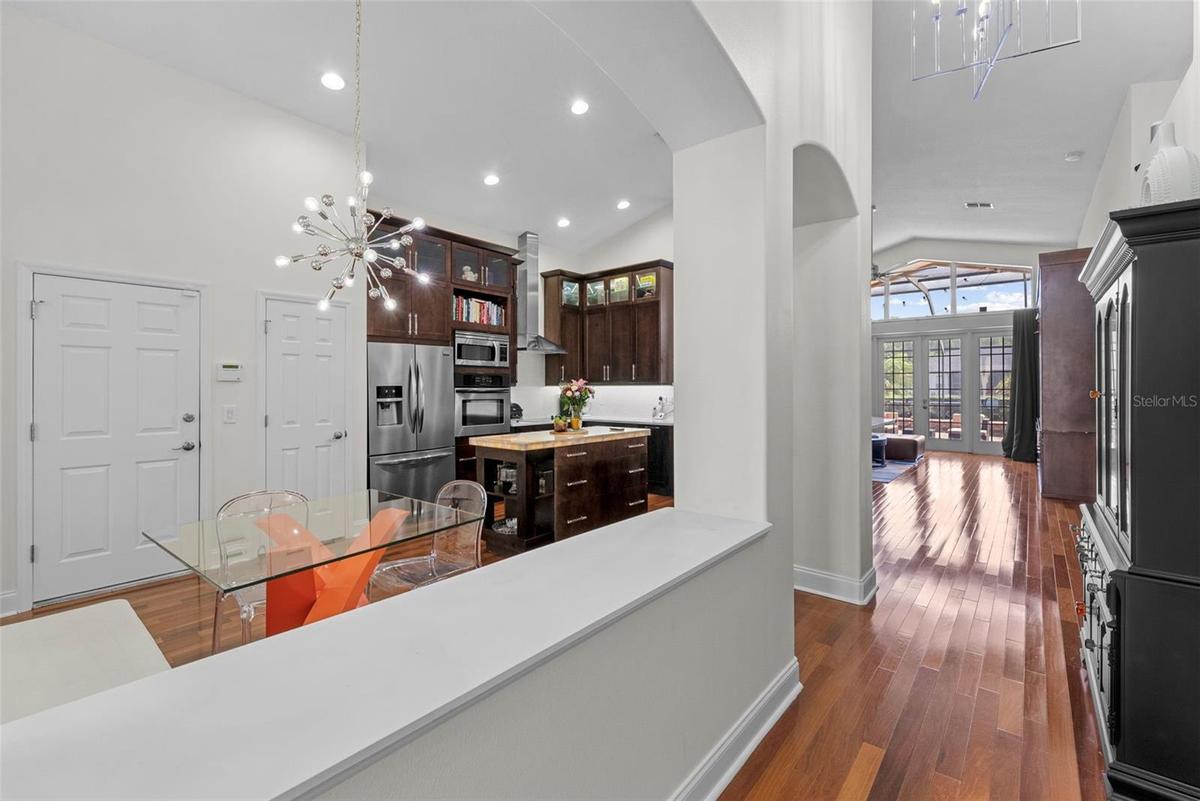 Open view from dining area toward kitchen and main living spaces.