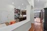 Open view from dining area toward kitchen and main living spaces.