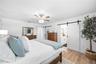 custom barn sliders to the walk in closet and ensuite bathroom