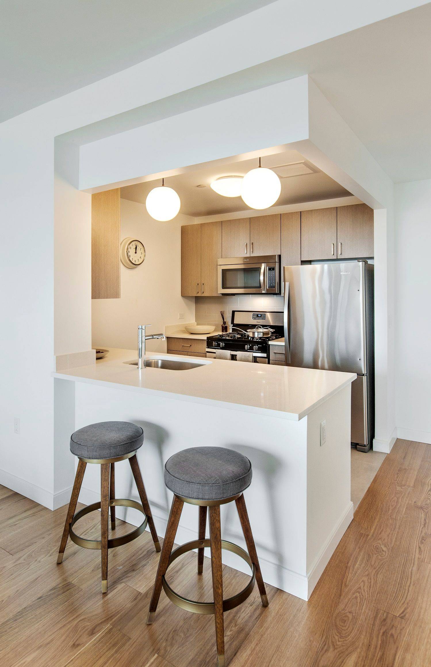 West facing 2 bedroom with over sized windows featuring Manhattan skyline views, an open kitchen featuring stainless steel appliances, Caesarstone quartz counters and an eating bar, and an in unit ...