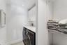 Laundry room featuring cabinet space, and independent washer and dryer.