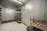 Basement with light tile patterned flooring