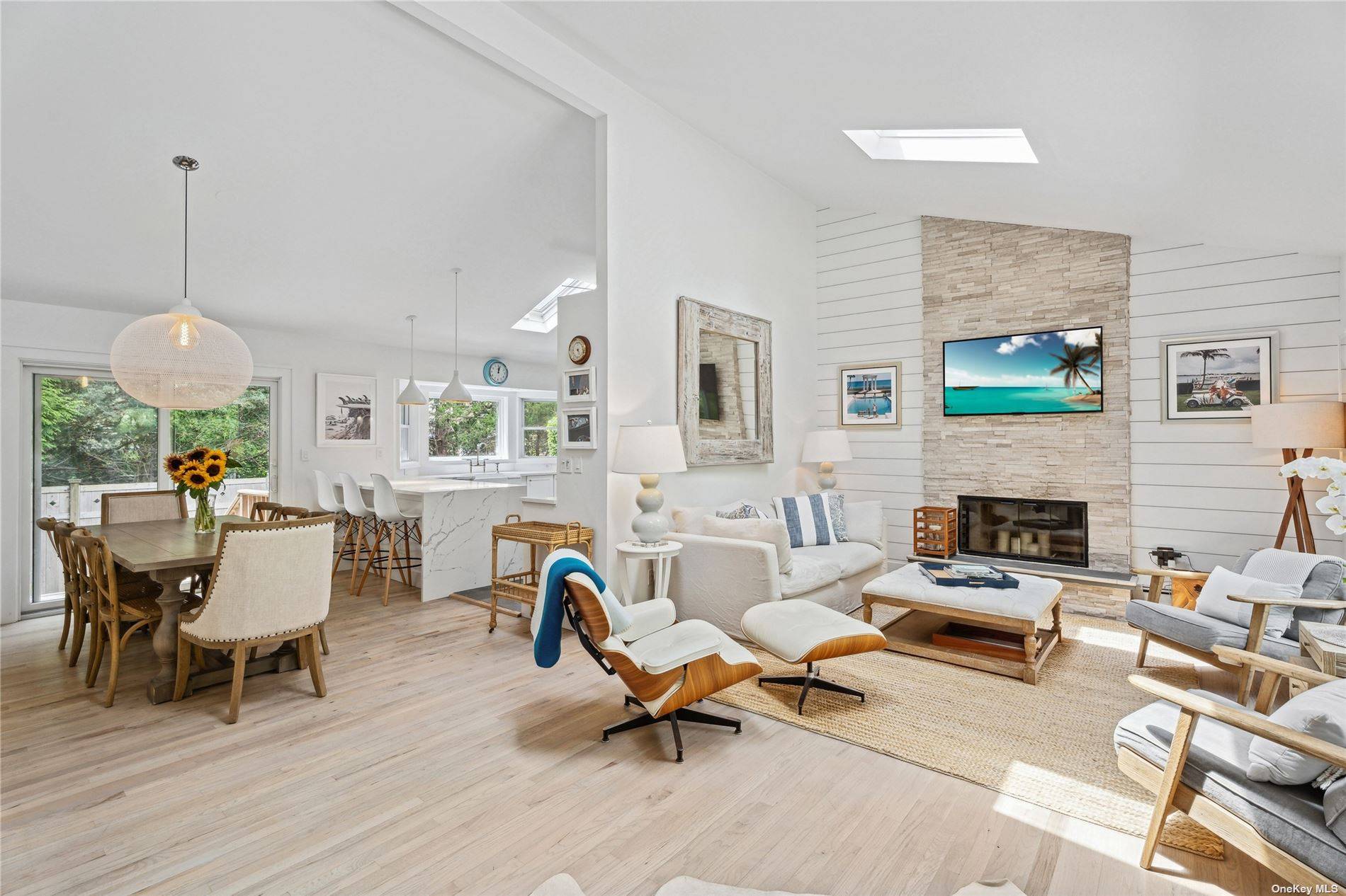 Down a long private driveway sits this secluded and charming Westhampton Beach Village Summer rental home that has been completely renovated with a Contemporary flair and style.