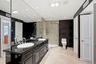 Walk-in marble shower.