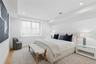 Bedroom with light wood finished floors and recessed lighting