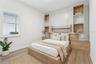 Second bedroom features its own custom built-in. Virtually Staged.