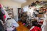 Bedroom with radiator heating unit, parquet flooring, and a closet