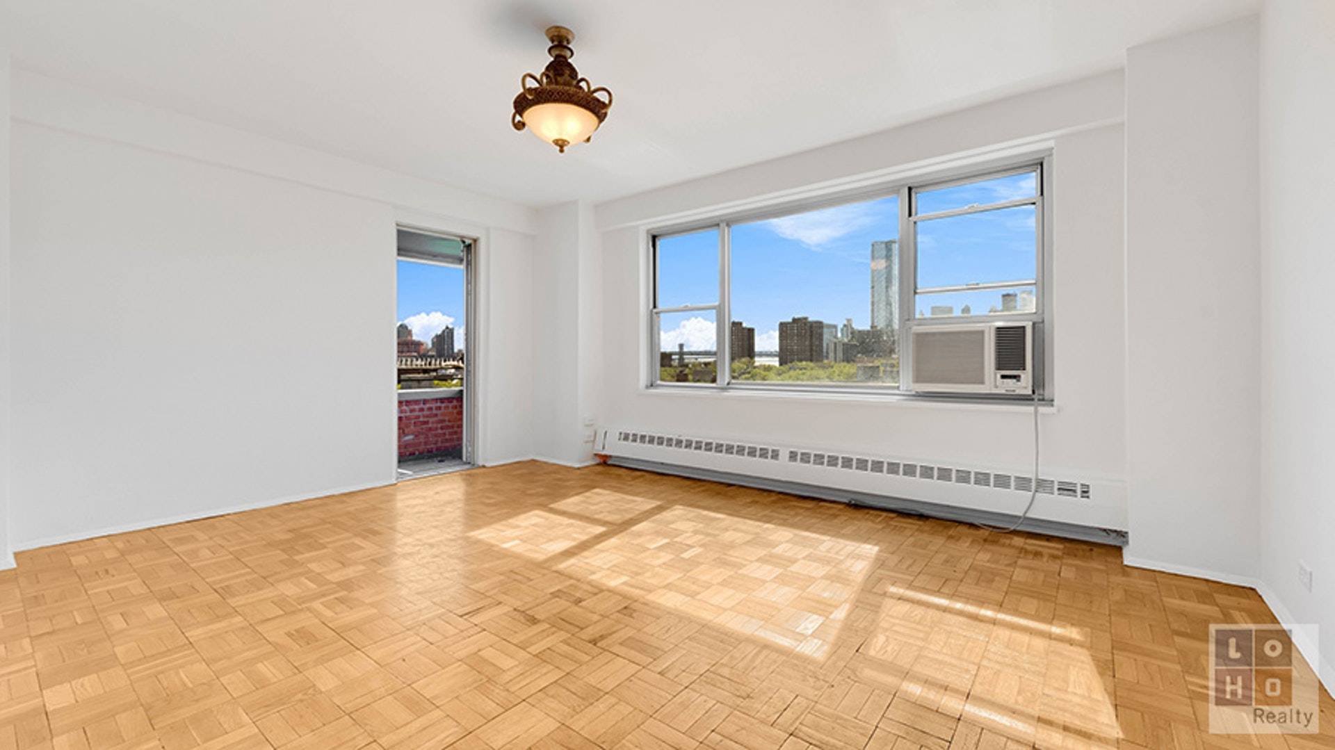 Sunny amp ; bright 2 bedroom with balcony apartment with views of the downtown skyline, featuring peaks of the Manhattan amp ; Brooklyn Bridges, and the Freedom Tower !