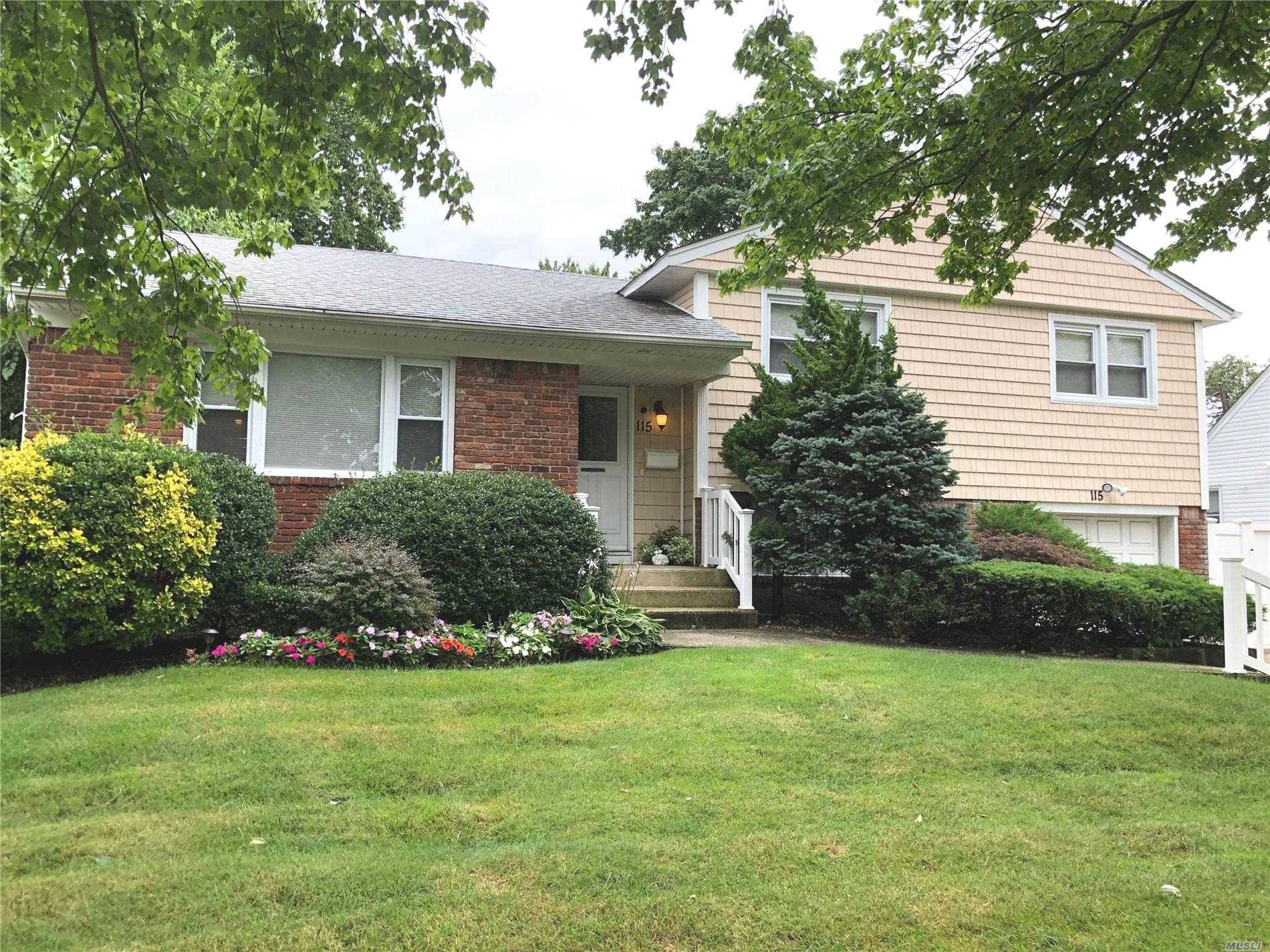 Meticulously Updated and Maintained Side by Side Split with All Over sized Rooms.