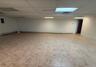 Empty room featuring a paneled ceiling and baseboard heating