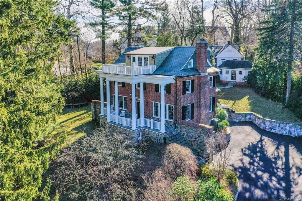 Welcome to 18 Avon Road, a distinguished Georgian Colonial residence, sited on a half acre of lushly landscaped property.